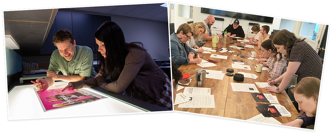 People examining a photo and team working at a large table