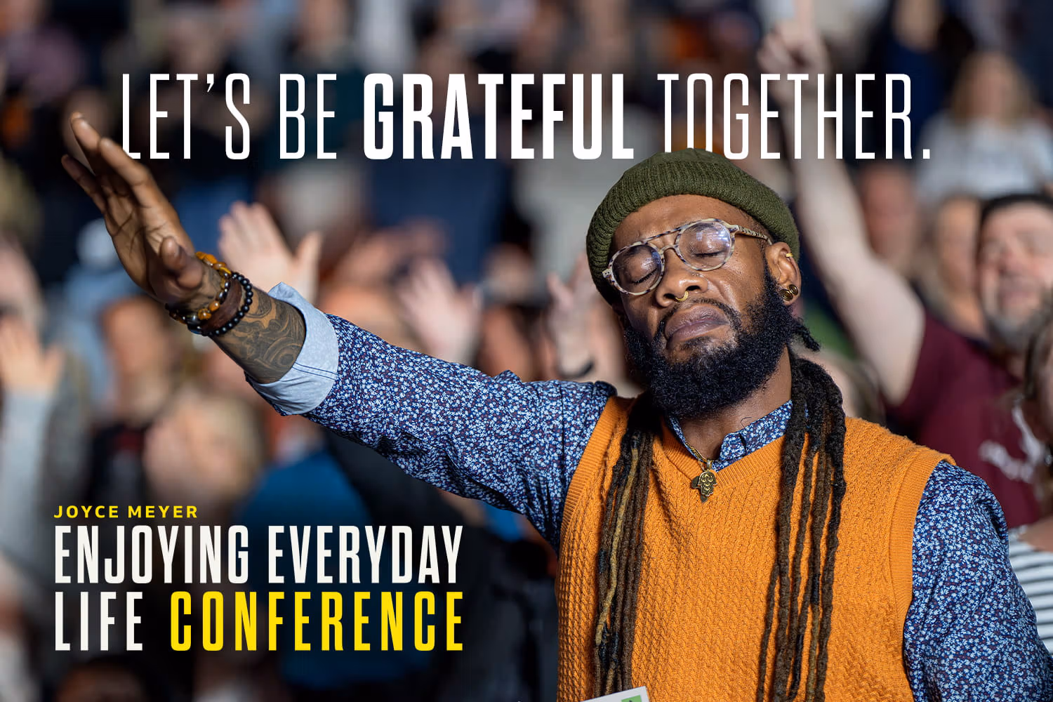 A man lifting his hand in worship