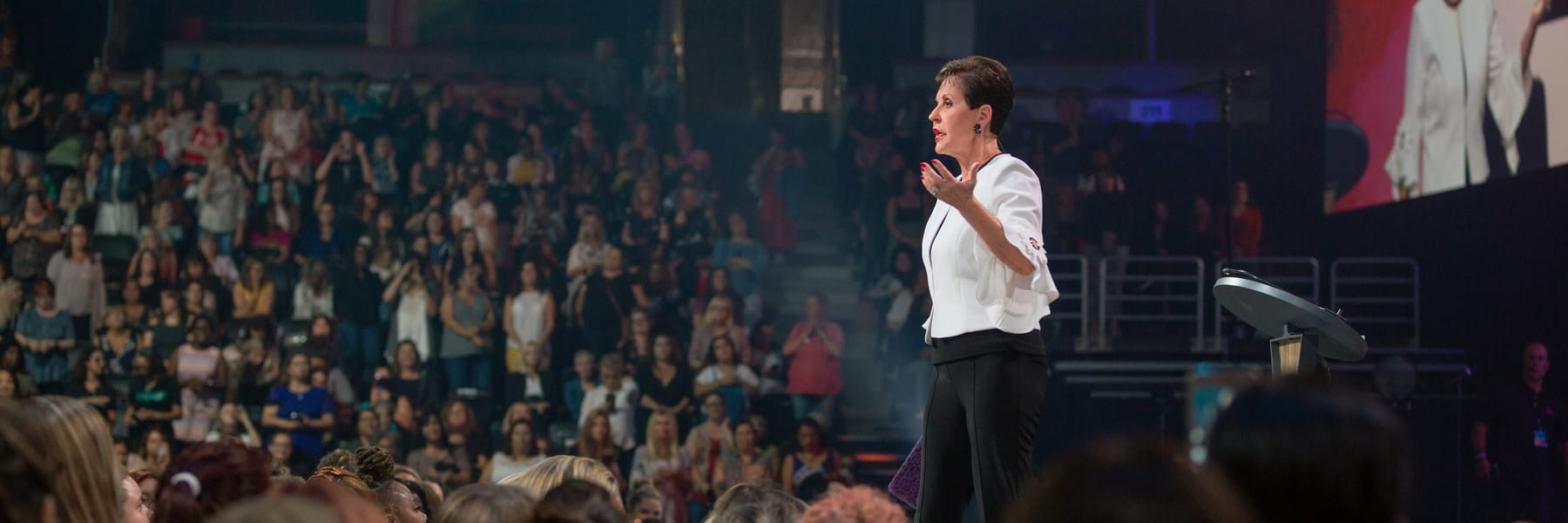 Joyce Meyer on stage speaking at a conference