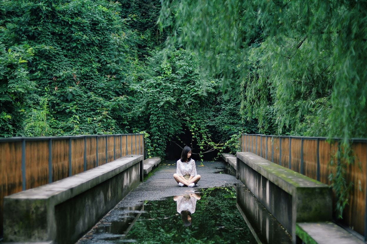 A women Meditating outside