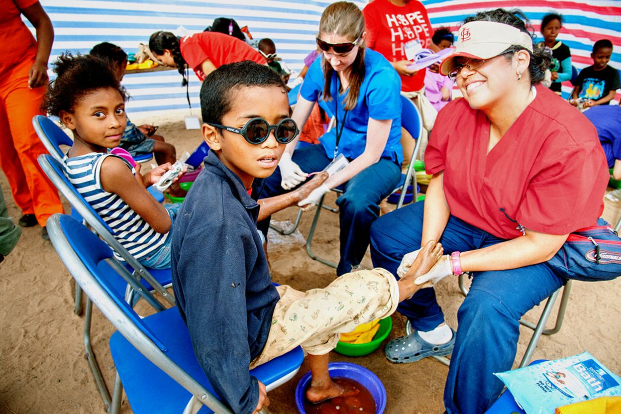 Pediatrician Washes Feet in Madagascar