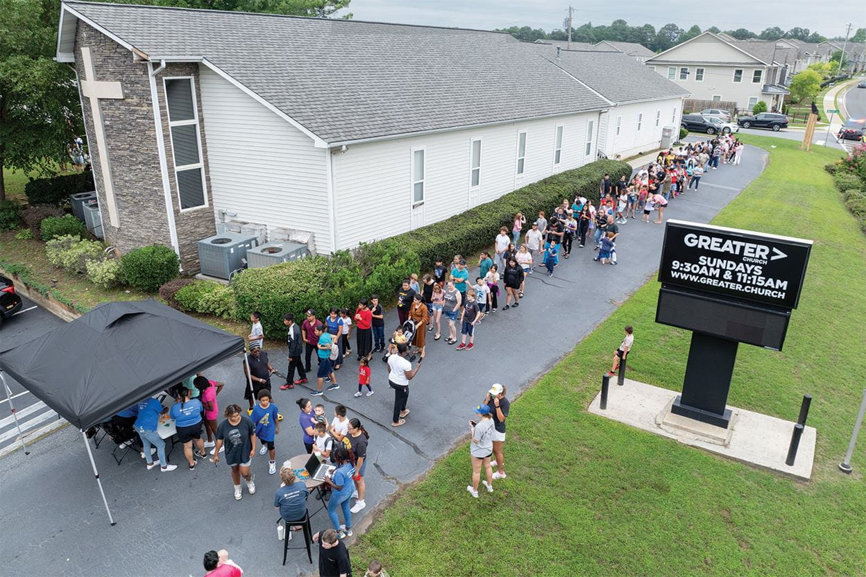 Families waiting in line for the back to school outreach to begin at Greater Church in Acworth Georgia