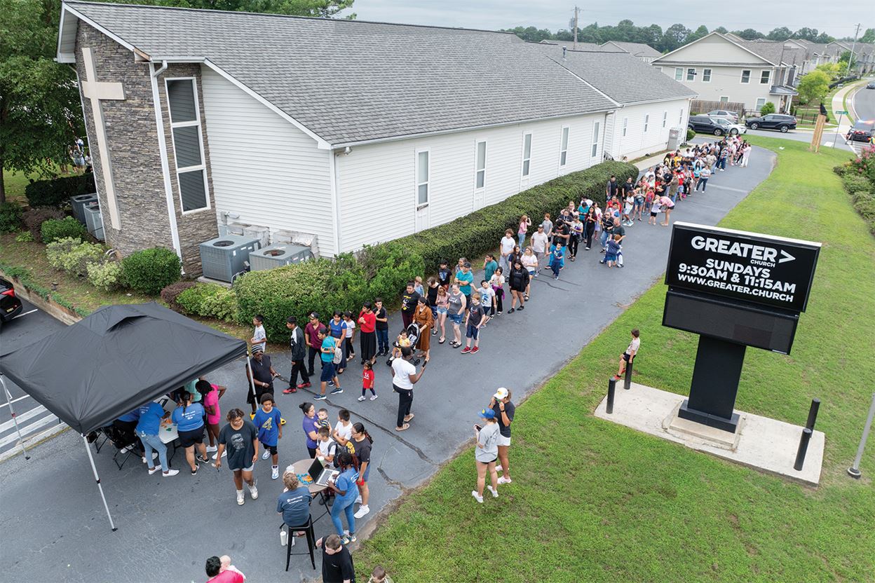 Families waiting in line for the back to school outreach to begin at Greater Church in Acworth Georgia