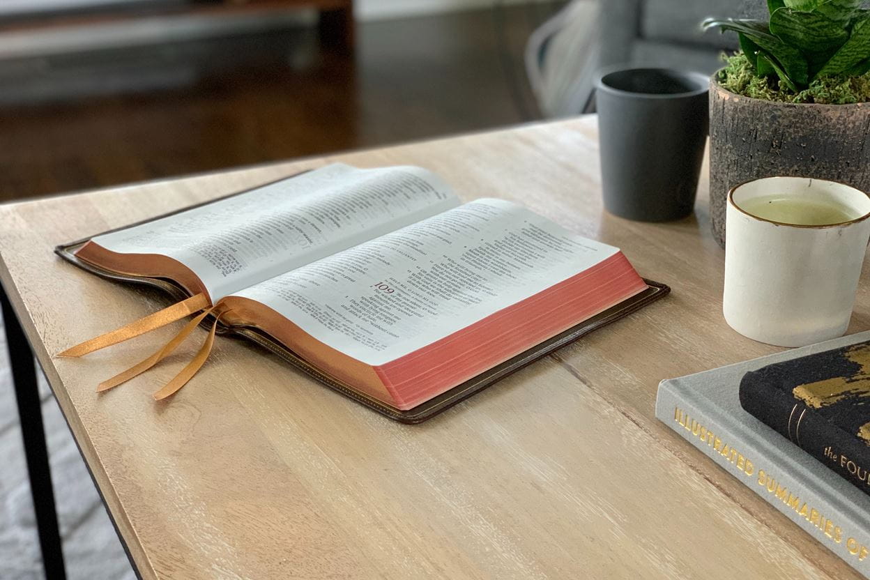 Bible open on a desk ready for reading a daily devotional.