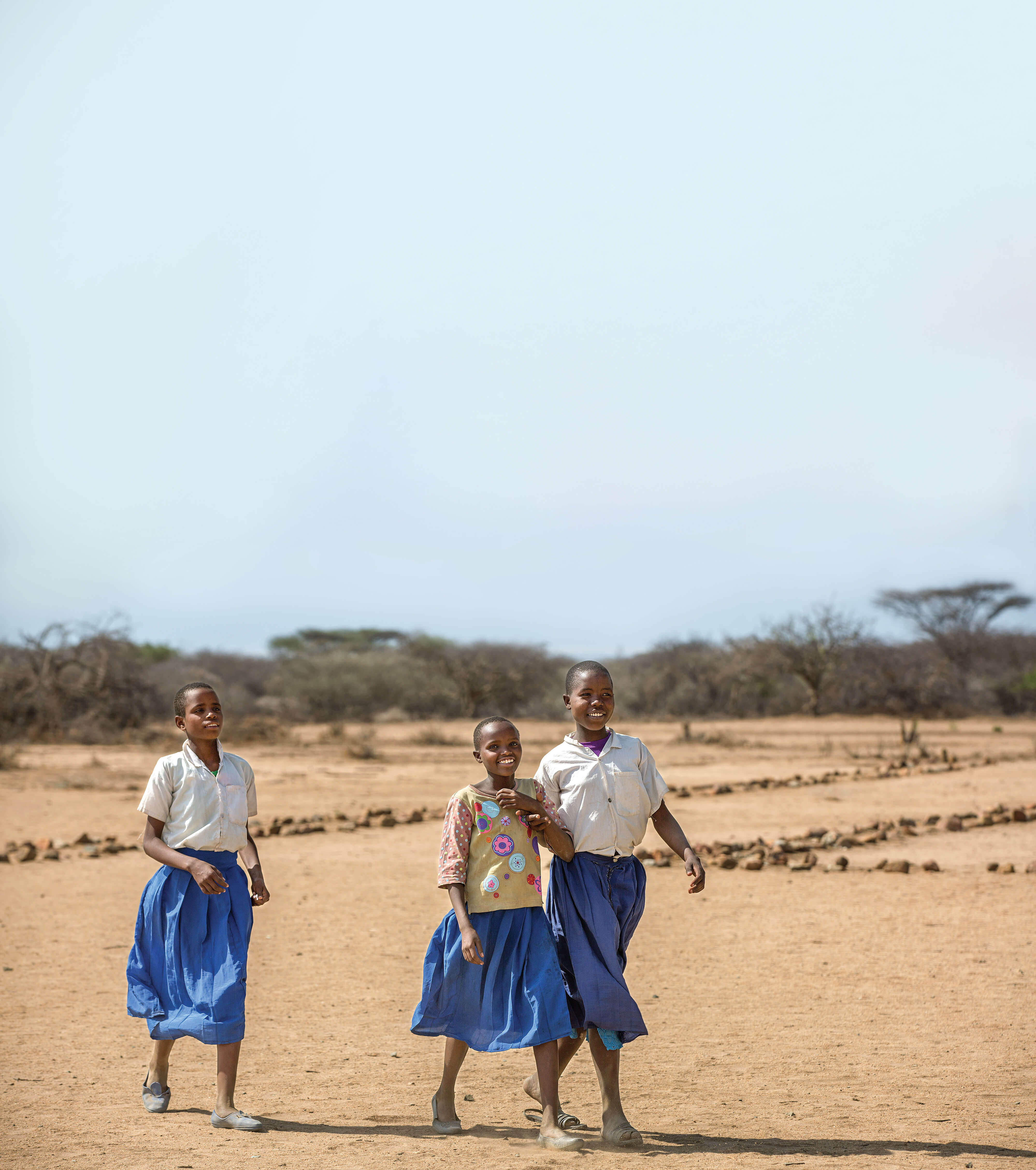 Girls walking in a field